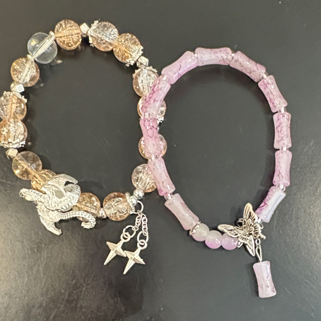 Pink And Brown Beaded Bracelets With Charms